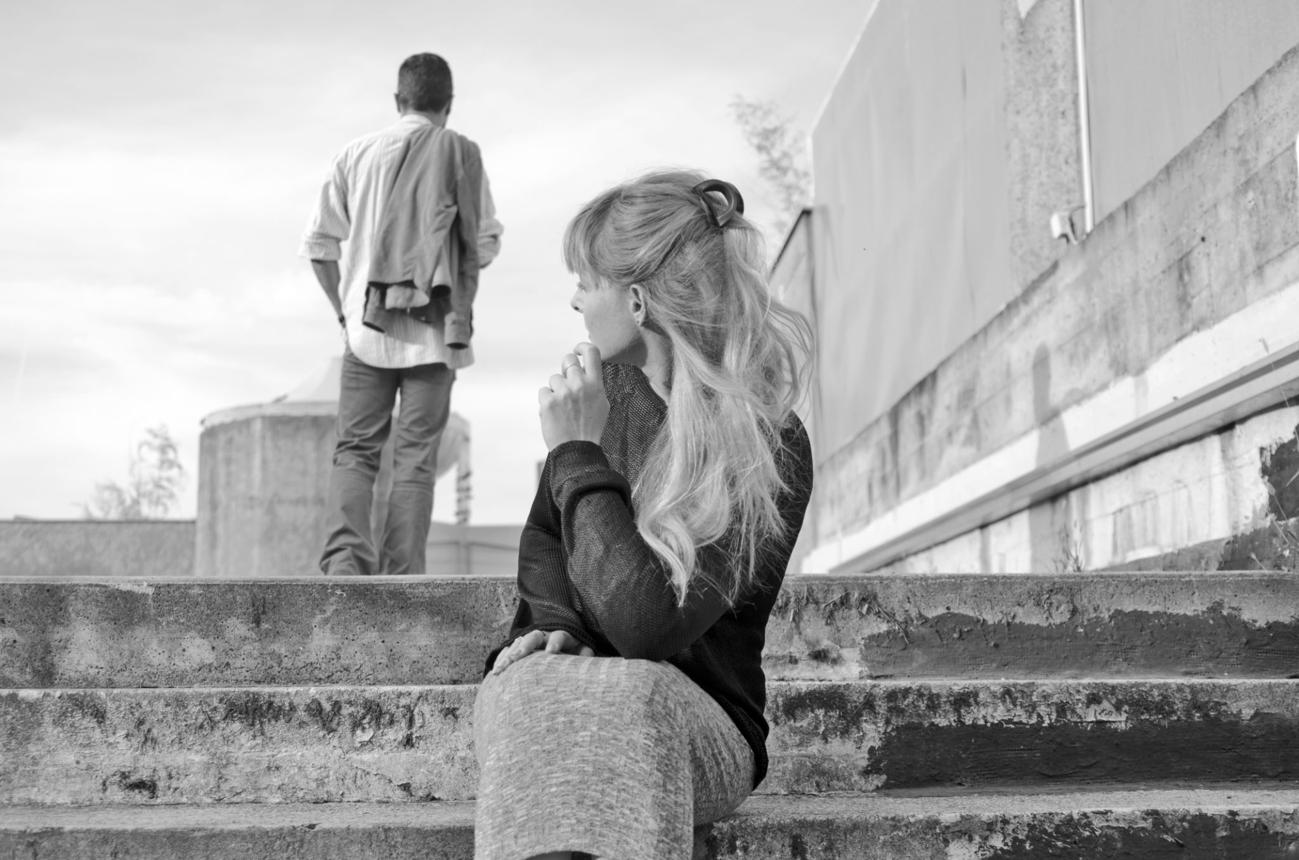 person walking away from another representing emotional distance and unresolved truth